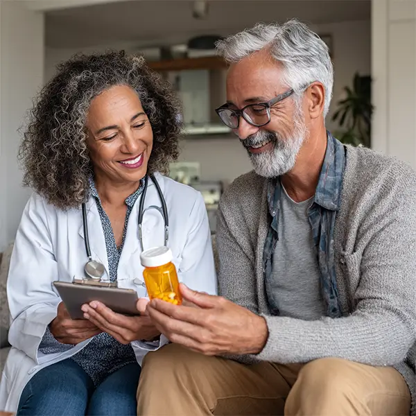 Clinician reviewing medication with new patient